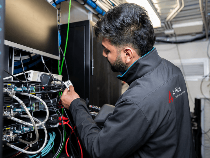 A Plus technician testing and tagging workplace electrical equipment